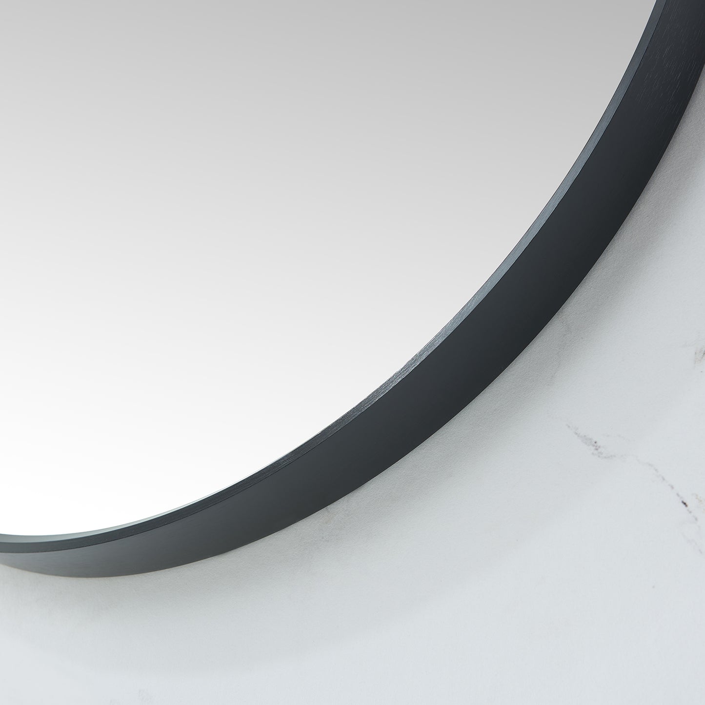 Cascante 35.4 in. W x 35.4 in. H Round Metal Wall Mirror in Brushed Black